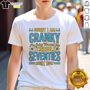 Top Sorry I Am Cranky I'M Going Through My Terrible Seventies Right Now T-Shirt design featuring humorous text and playful graphics.