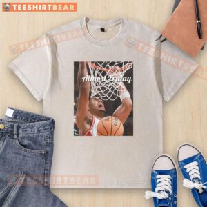 Good Koa Peat Arizona Wildcats Basketball Almost Friday washed t-shirt displayed on a wooden background.
