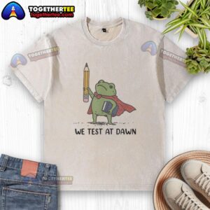 Premium teacher frog holding a giant pencil and calculus book, wearing a 'We Test at Dawn' washed T-shirt.