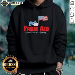 Alt Text: Original Farm Aid Keep America Growing hoodie featuring a tractor logo and American flag design.