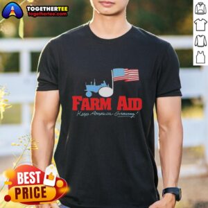 Premium Farm Aid Keep America Growing t-shirt featuring a tractor and American flag logo.