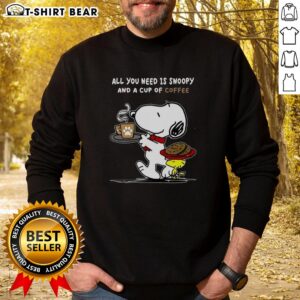 Cozy sweatshirt featuring Snoopy and coffee design, perfect for casual wear. Ideal for fans of Peanuts and comfy fashion.