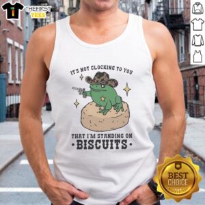 Pretty frog cowboy holding a pistol, wearing a tank top that says 'It's not clocking to you, I'm standing on biscuits.'