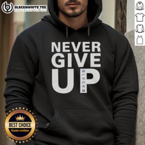 Mohamed Salah wearing a Never Give Up hoodie, showcasing his determination and style on and off the field.
