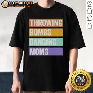 Alt Text: Retro 'Throwing Bombs Banging Moms' T-shirt design featuring bold typography and vibrant colors on a casual tee.