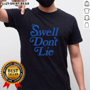 Top The Swell Don't Lie T-Shirt featuring a vibrant design, perfect for beach lovers and casual wear enthusiasts.