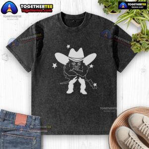 Awesome medium build weird guy wearing a cowboy washed t-shirt, showcasing a unique fashion style outdoors.