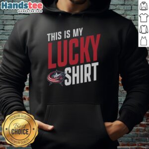 Fan wearing a Columbus Blue Jackets hoodie, showcasing team spirit and style during a game.