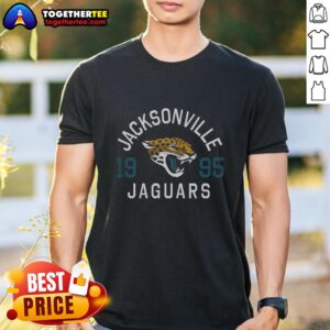 Alt Text: Stylish Hot Jacksonville Jaguars Heritage Print T-Shirt featuring team colors and logo, perfect for fans.