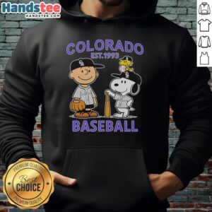 Alt Text: Charlie Brown, Snoopy, and Woodstock wear a Colorado Rockies jersey on a hoodie, established in 1993.