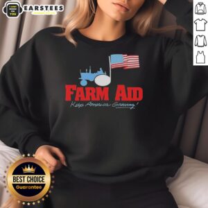 Original Farm Aid Keep America Growing sweatshirt featuring a tractor logo and American flag design.