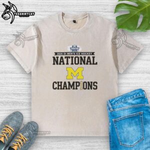 Premium Michigan Wolverines 2026 Di Men's Ice Hockey Frozen Four Champions washed t-shirt in navy blue.