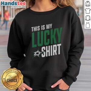 Fan wearing a 'This Is My Lucky Sweatshirt' supporting the Hot Dallas Stars at a vibrant hockey game.