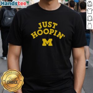 Official Michigan Wolverines Just Hoopin T-Shirt featuring bold team logo and sporty design for fans and athletes.