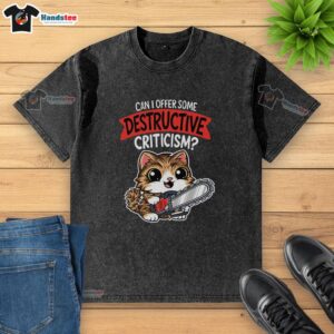 Cute cat wearing a 'Can I Offer Some Destructive Criticism?' washed t-shirt, showcasing playful humor and style.