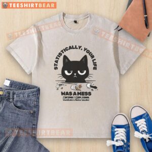 Funny cat washed t-shirt: 'Statistically, your life was a mess before I got here' with a playful feline graphic.