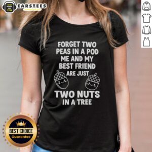 Two friends wearing matching 'Two Nuts in a Tree' tees, celebrating friendship and fun in a playful outdoor setting.