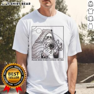 Official Please Hold While I Consult My Orb T-Shirt featuring a whimsical design and vibrant colors for fans of quirky apparel.