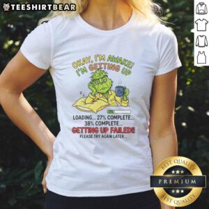 Funny Grinch graphic tee for women with 'Okay, I'm Awake, I'm Getting Up' design, perfect for holiday cheer.