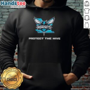 Alt Text: Fan wearing a teal hoodie at the Nice Charlotte Hornets Protect The Hive rally, showcasing team spirit and unity.