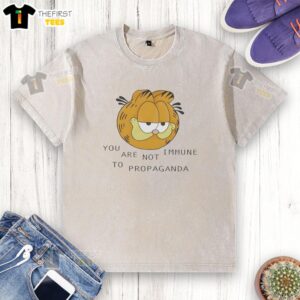 Alt Text: Premium tabby cat head graphic on You Are Not Immune to Propaganda washed t-shirt, perfect for cat lovers.