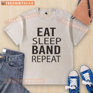 Alt Text: Nice band Eat Sleep Repeat musician in a washed t-shirt, showcasing a relaxed style and passion for music.