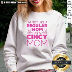 Mom wearing 'Nice, I'm Not Like A Regular Mom' sweatshirt, showcasing a fun and trendy style for unique moms.
