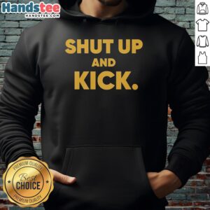 Harrison Butker of Kansas City Chiefs in a 'Shut Up and Kick' hoodie, showcasing team spirit and style.