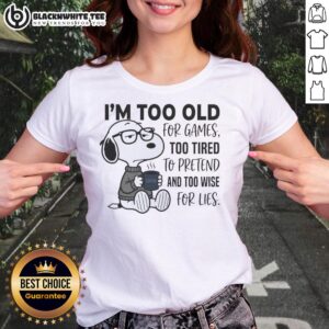 Alt Text: Funny Snoopy graphic on a ladies tee: 'Too Old for Games, Too Tired to Pretend, Too Wise for Lies' design.