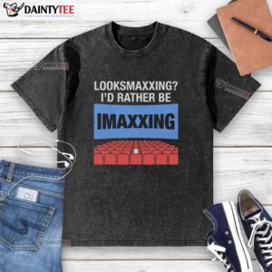 Alt Text: Nice Looksmaxxing I'd Rather Be Movie Maxxing washed t-shirt displayed on a hanger, showcasing casual style.