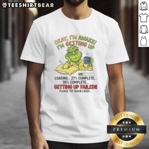 Funny Grinch t-shirt design with 'Okay I'm Awake' and loading progress, perfect for Christmas humor lovers.