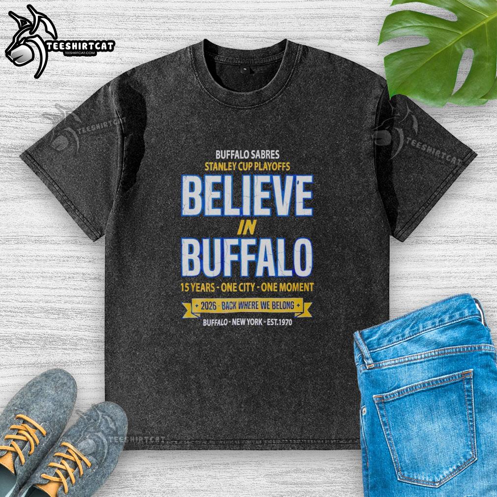 awesome-buffalo-sabres-2026-stanley-cup-playoffs-believe-in-buffalo-washed-t-shirt Alt Text: Awesome Buffalo Sabres 2026 Stanley Cup Playoffs Believe In Buffalo washed t-shirt in blue with team logo design.