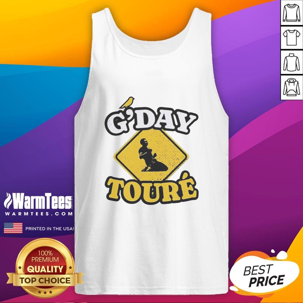 awesome-mo-toure-of-norwich-city-gday-toure-vintage-tank-top Awesome Mo Toure of Norwich City wearing a vintage tank top in a vibrant outdoor setting, showcasing sporty style.