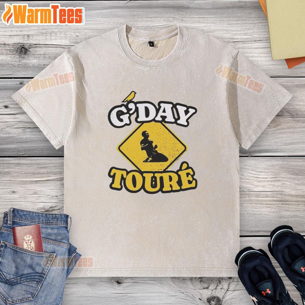 awesome-mo-toure-of-norwich-city-gday-toure-vintage-washed-t-shirt Awesome Mo Toure of Norwich City G'day Toure vintage washed t-shirt displayed on a wooden background.