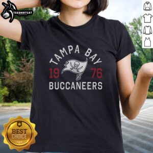 Alt Text: Official Tampa Bay Buccaneers Heritage Print Ladies Tee featuring the team's logo and vibrant design for fans.