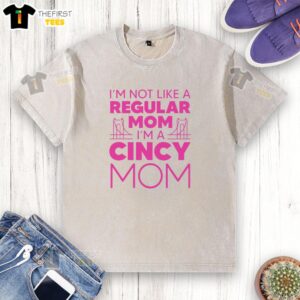 Pretty I'm Not Like A Regular Mom washed t-shirt design featuring playful typography on a light background.