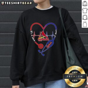 Alt Text: Hot St. Louis Cardinals sweatshirt featuring a stethoscope and heartbeat shape design, perfect for fans and health enthusiasts.