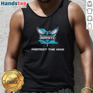 Fan wearing a Nice Charlotte Hornets Protect The Hive teal tank top at a rally, showcasing team spirit and style.