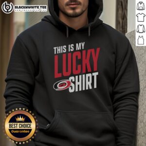 Person wearing a Top Carolina Hurricanes hoodie, showcasing team spirit and style at a game or event.