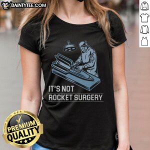 Funny It's Not Rocket Surgery Ladies Tee featuring a humorous graphic and playful text, perfect for casual wear.