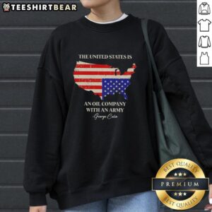 Alt Text: George Carlin sweatshirt featuring 'Pretty, the United States is an oil company with an army' design.