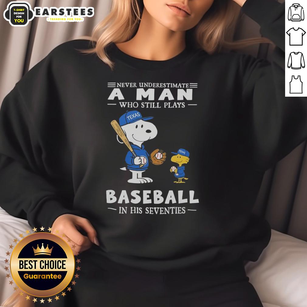 cute-the-peanuts-x-texas-rangers-never-underestimate-a-man-who-still-plays-baseball-in-his-seventies-sweatshirt Alt Text: Cute Peanuts X Texas Rangers sweatshirt featuring 'Never Underestimate A Man Who Still Plays Baseball In His Seventies' design.