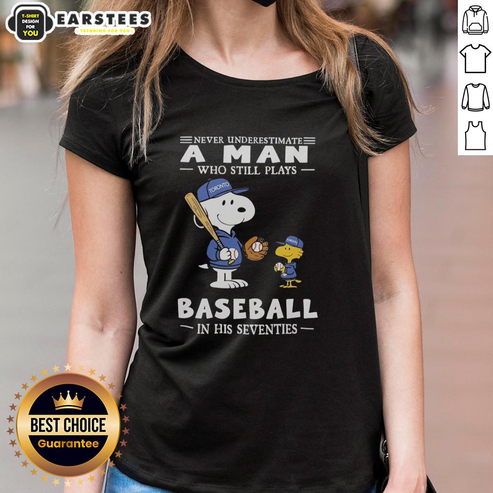 cute-the-peanuts-x-toronto-blue-jays-never-underestimate-a-man-who-still-plays-baseball-in-his-seventies-ladies-tee Alt Text: Cute Peanuts x Toronto Blue Jays tee for women celebrates seniors playing baseball in their seventies with style.