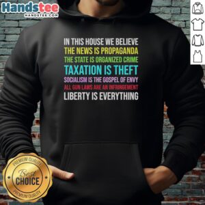 Alt Text: Official Libertarian version hoodie featuring 'In This House We Believe' slogan, perfect for political supporters.