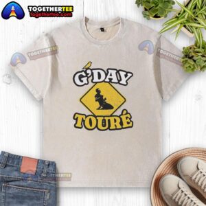 Official Mo Toure Norwich City Gday Toure vintage washed t-shirt featuring team colors and logo for fans.