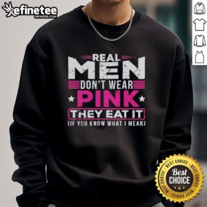 Alt Text: Original Real Men Don't Wear Pink They Eat It Sweatshirt featuring bold text and vibrant colors for men's fashion.