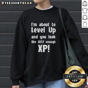 Premium sweatshirt featuring 'About to Level Up' design, perfect for gamers seeking stylish XP-themed apparel.