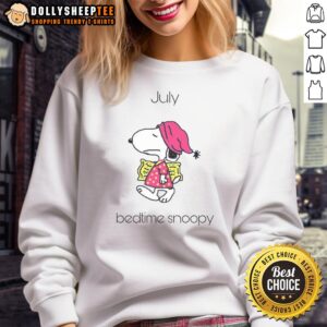 Cozy Pretty July Bedtime Snoopy sweatshirt featuring a charming Snoopy graphic, perfect for relaxing evenings.