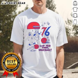 Alt Text: Premium Philadelphia 76ers X Snoopy and Woodstock Clap Your Hands Everybody T-Shirt featuring vibrant graphics.