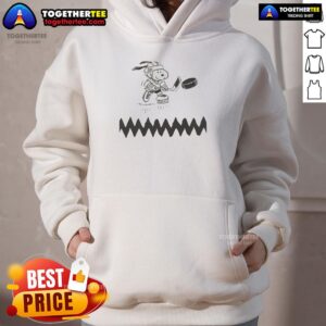 Graphic hoodie featuring Snoopy as a dog hockey player, perfect for fans of fun, sporty apparel and unique designs.